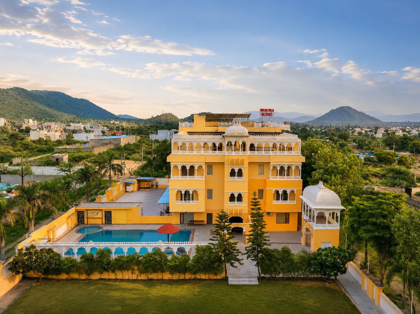 Dream Hills Resort at sunset with the Aravalli hills behind